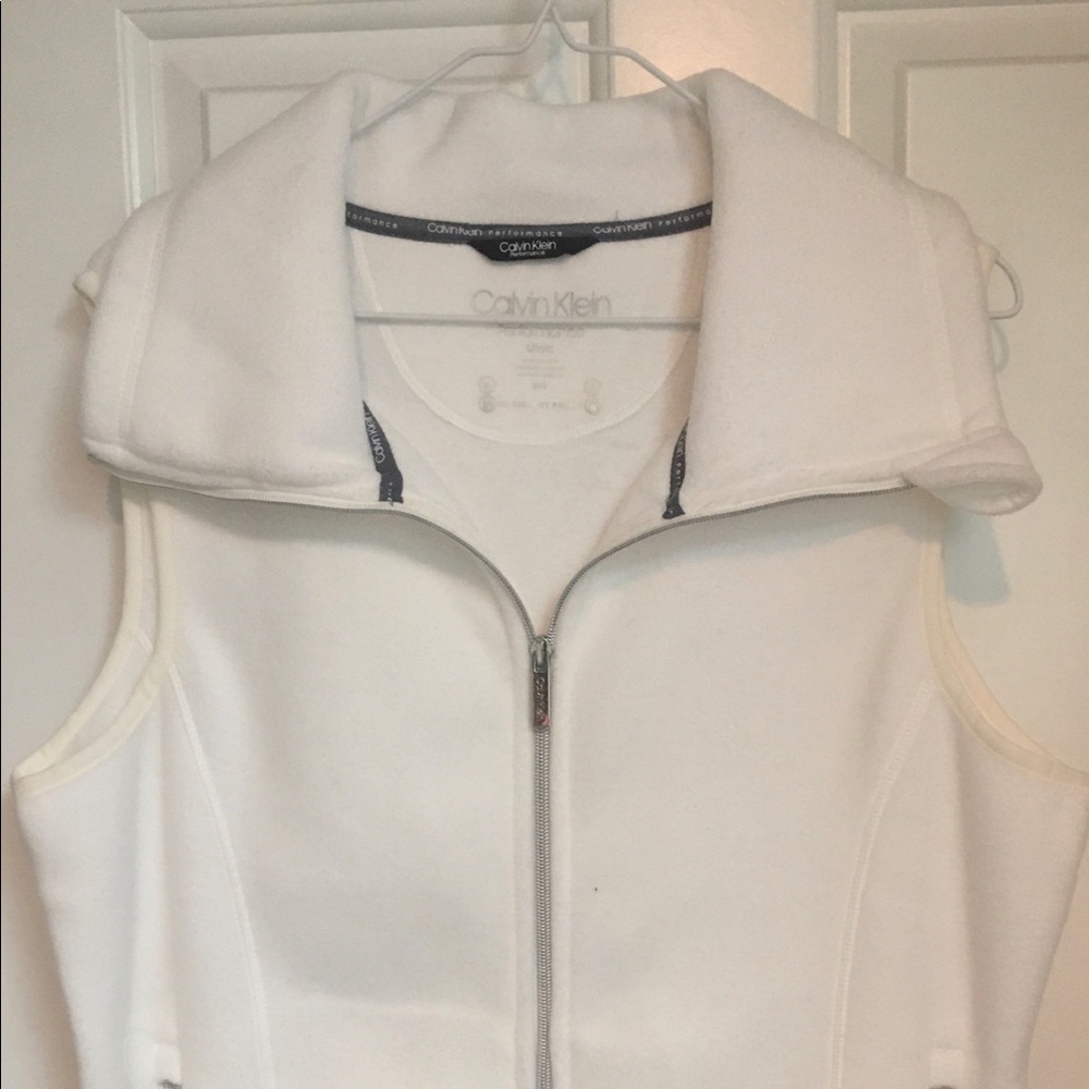 Calvin Klein; white large jacket vest;pockets; zipper;great zipper pockets too